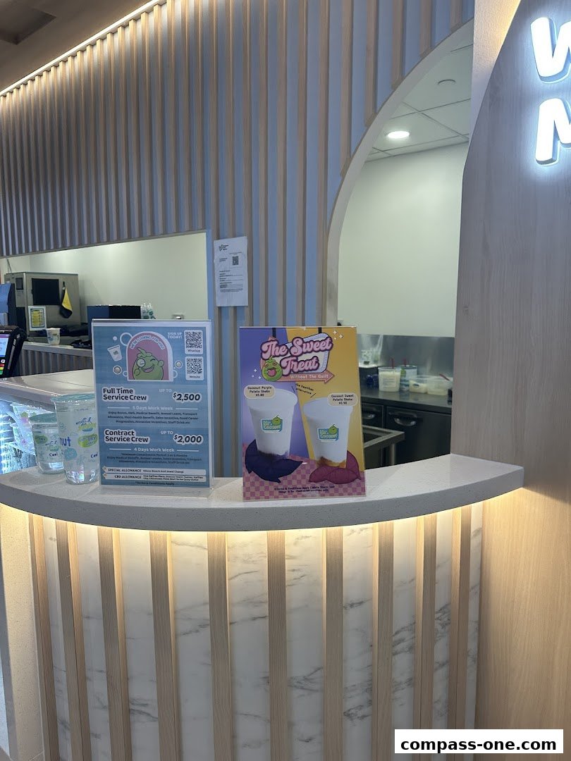 A counter display at Mr. Coconut featuring job advertisements and drink promotions.
