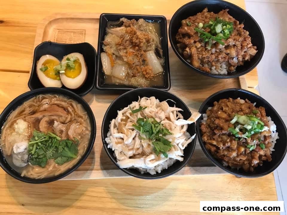 A spread of delicious Taiwanese comfort food, including braised pork rice bowls and noodle soup.