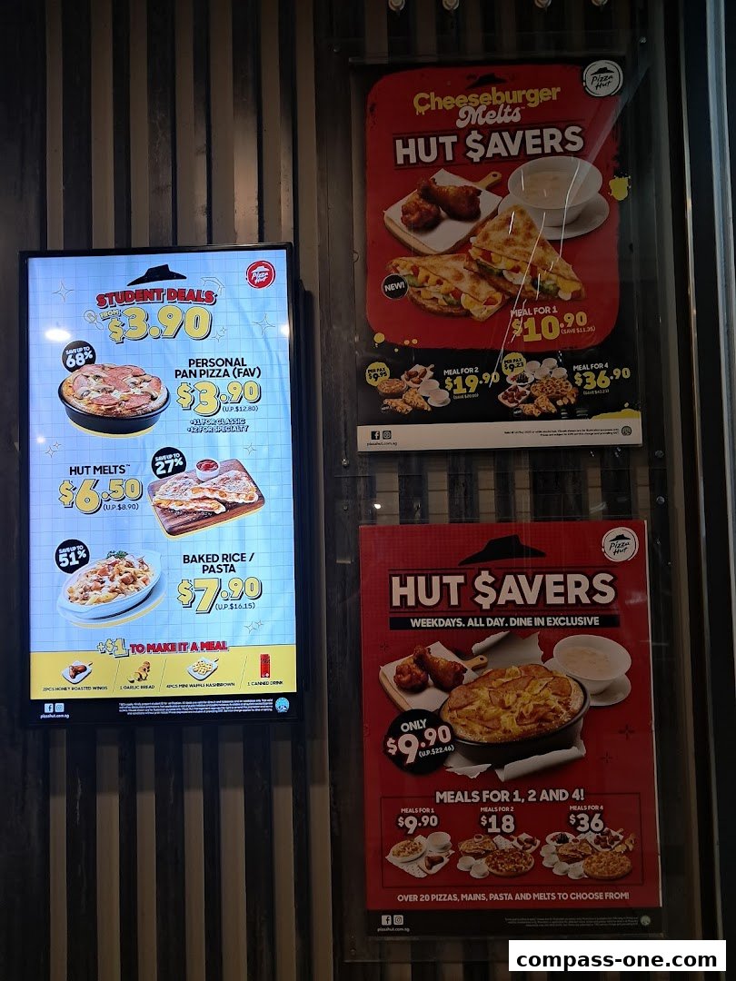 Pizza Hut promotional posters showcasing student deals and various meal saver offers.