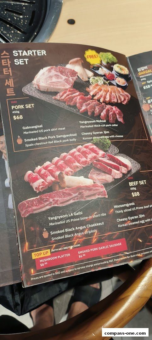 A menu featuring Korean BBQ sets, including pork and beef options, with detailed descriptions and prices.