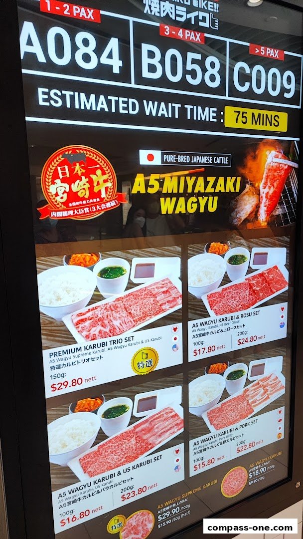 A digital menu board displaying various A5 Miyazaki Wagyu beef sets and prices.