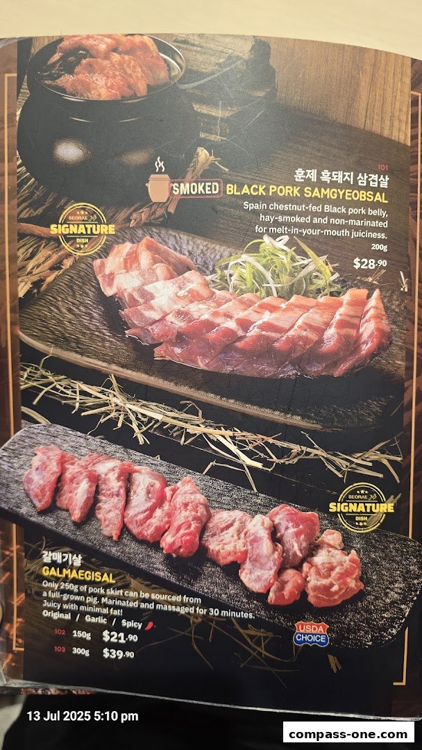 A menu showcasing two signature pork dishes: Smoked Black Pork Samgyeobsal and Galmaegisal.