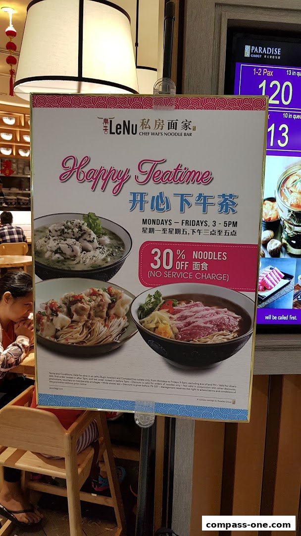 A promotional sign for LeNu Chef Wai's Noodle Bar offering a 30% discount on noodles during happy teatime.