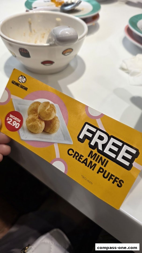 A promotional flyer for free mini cream puffs from Genki Sushi.