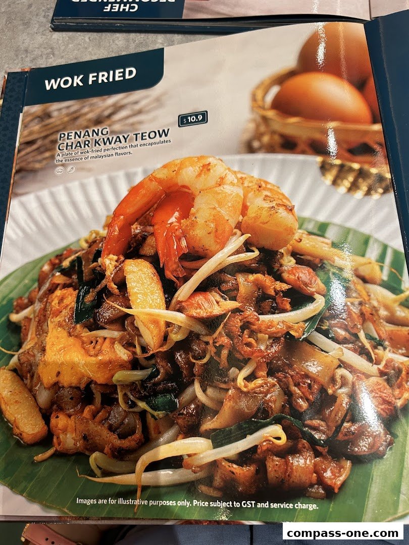 A menu page featuring Penang Char Kway Teow with shrimp and bean sprouts.