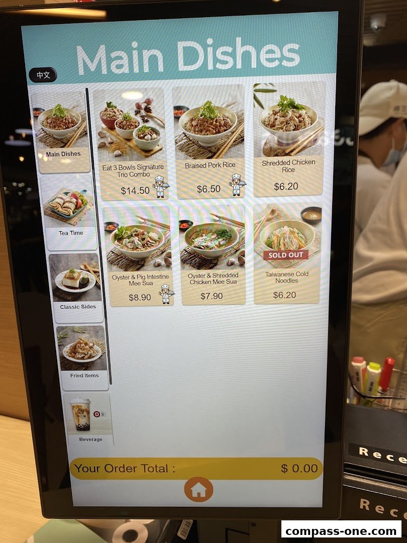 A digital menu displaying main dishes, sides, and beverages from Eat 3 Bowls.