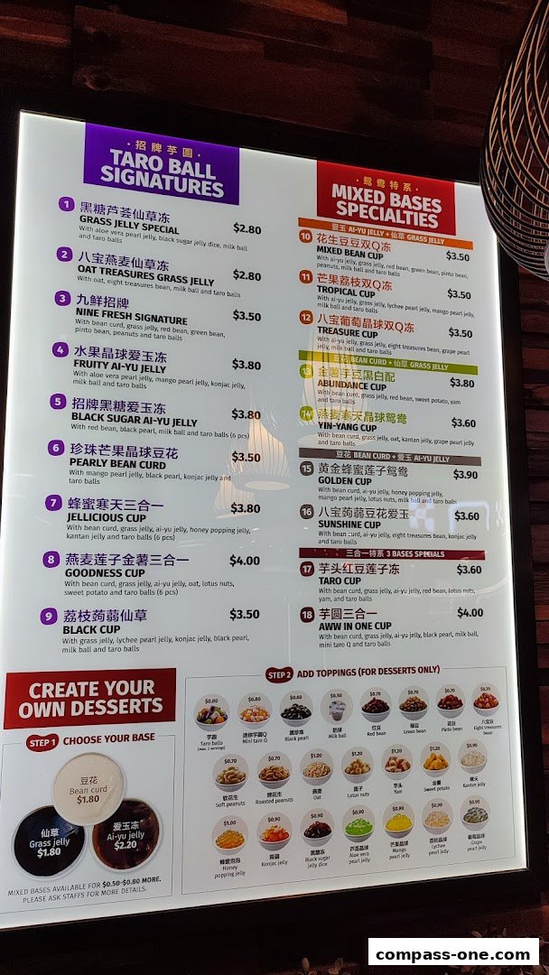A menu board for Nine Fresh Desserts Taiwan, showcasing signature taro ball desserts and mixed base specialties.