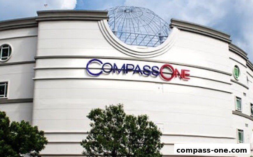 The exterior of the Compass One shopping mall with its distinctive signage.