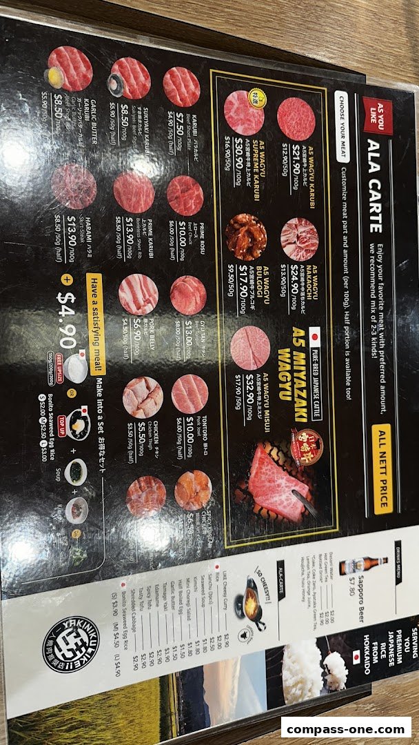 A menu for Yakiniku Like featuring various cuts of beef, pork, and chicken, with prices and descriptions.