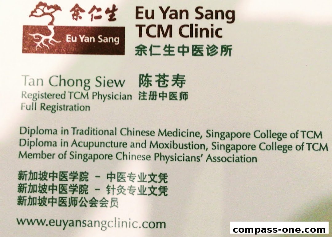 Business card for Eu Yan Sang TCM Clinic, featuring a physician's name and qualifications.