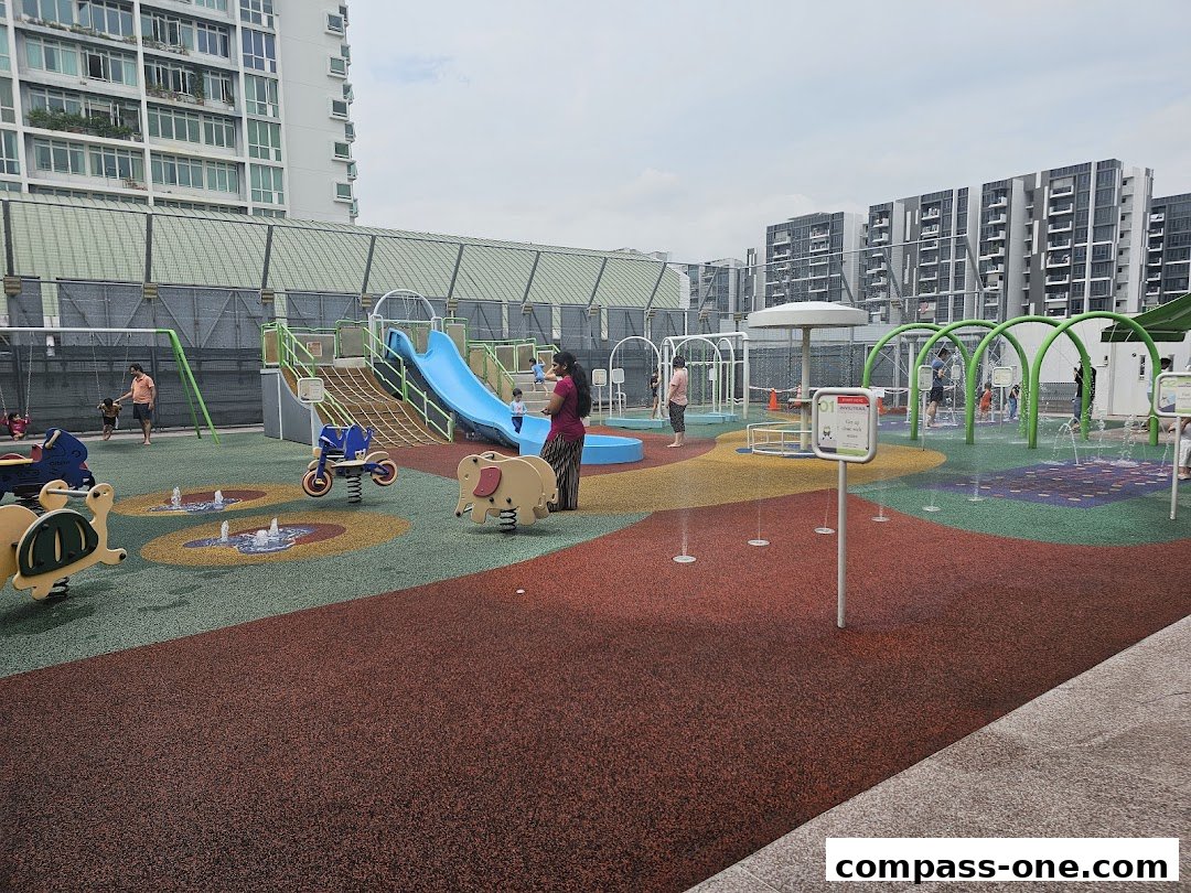 A vibrant water playground with slides, swings, and water features for children.