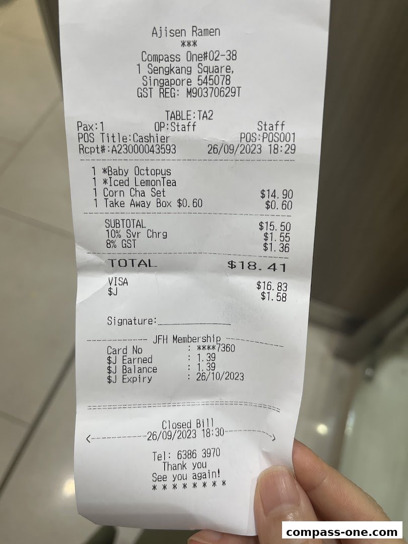 A receipt from Ajisen Ramen showing a purchase of ramen, iced lemon tea, and a corn cha set.