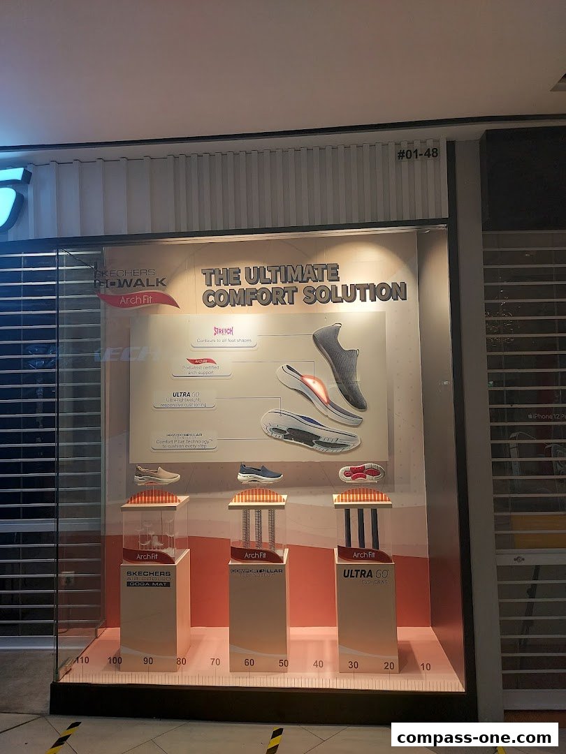 Skechers shop window display showcasing the Arch Fit shoe line and its comfort features.