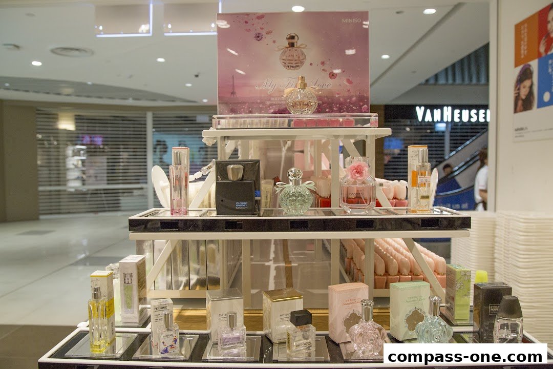 A display of various perfumes and fragrances from MINISO.