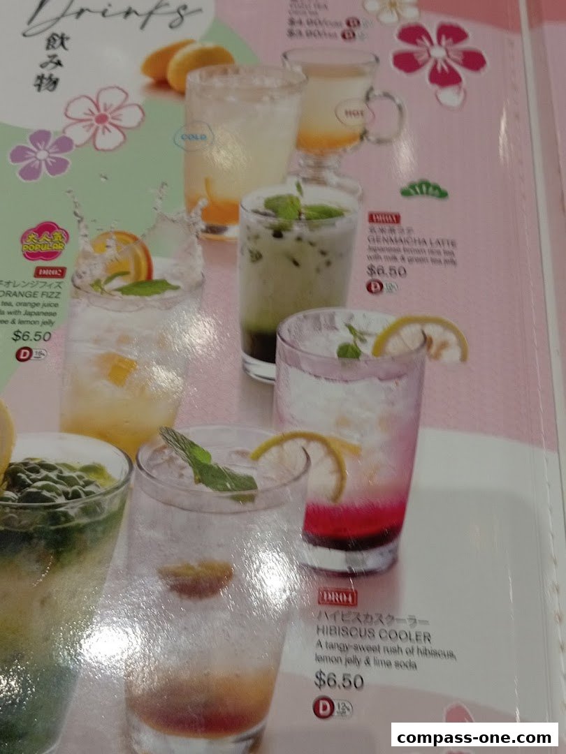 A menu page showcasing various refreshing drinks with colorful garnishes and prices.