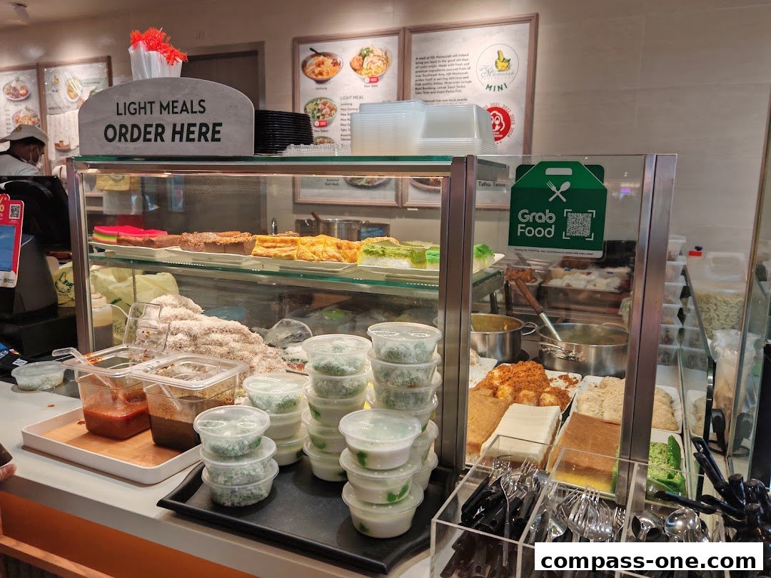A display of traditional Malay cakes and desserts at Hjh Maimunah Mini.
