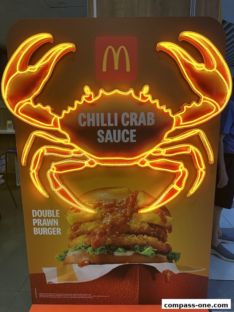 McDonald's advertisement featuring a Double Prawn Burger with Chilli Crab Sauce.