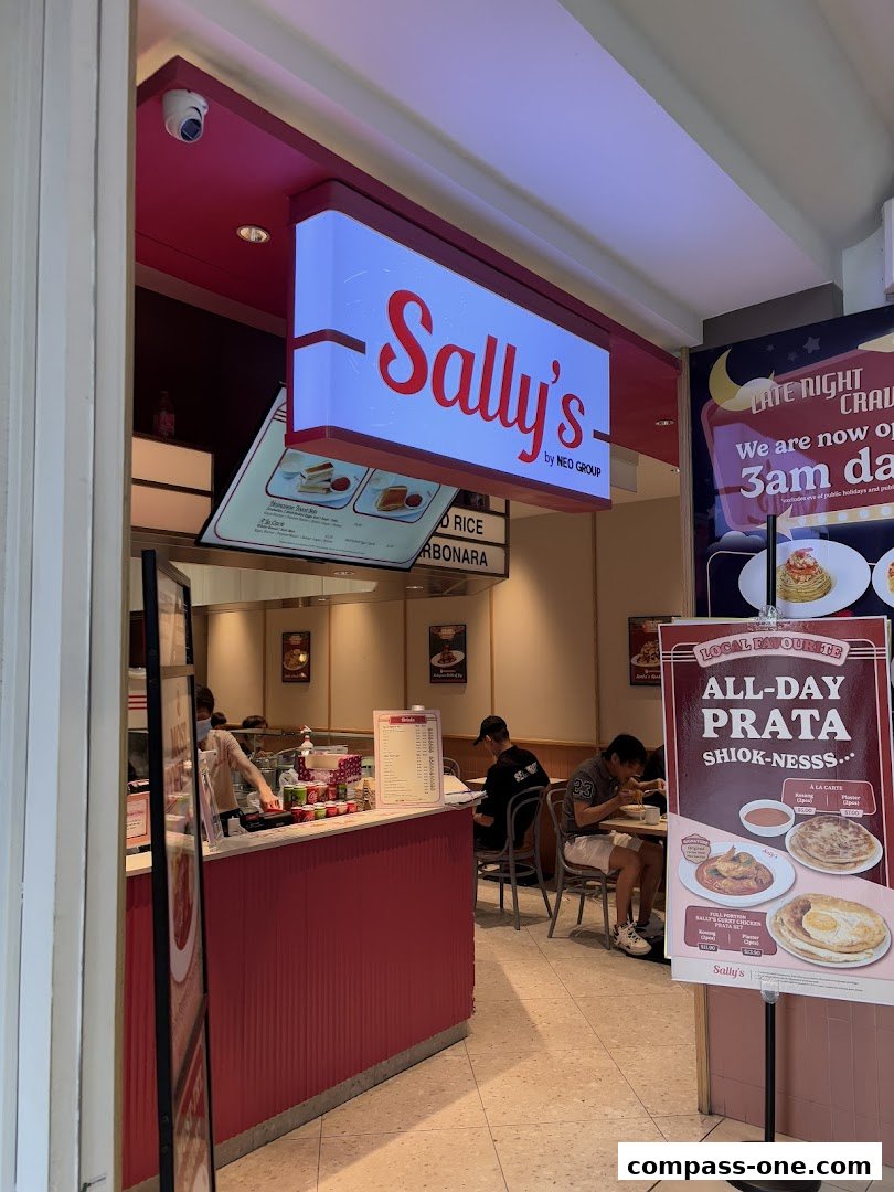 The entrance to Sally's restaurant, featuring its illuminated sign and a display of menu items.