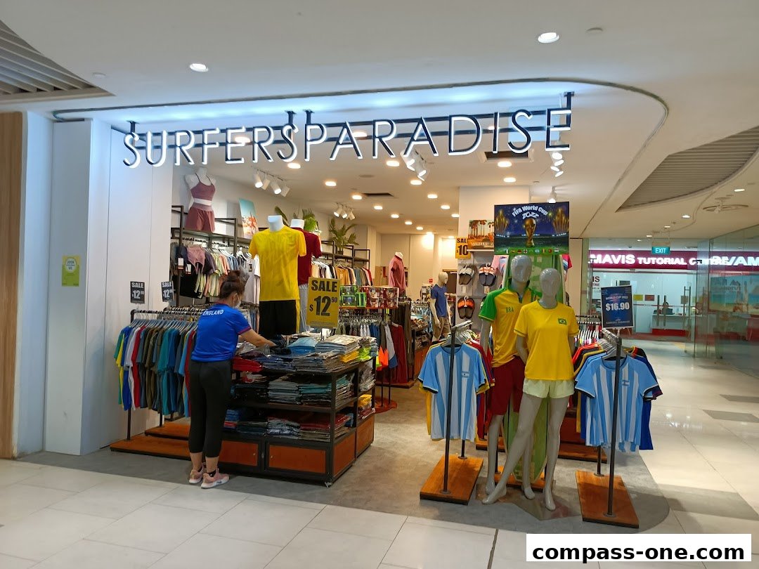 Surfers Paradise shop front displaying sportswear and mannequins with sale signs.