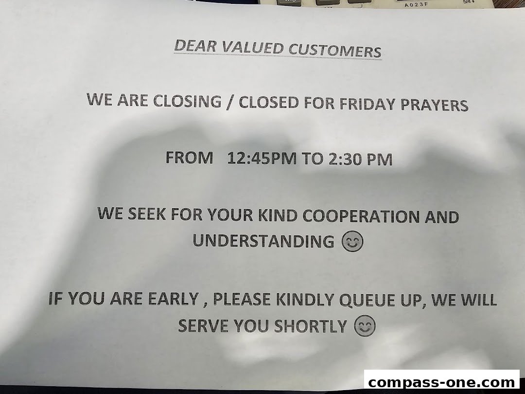 A notice informing customers about temporary closure for Friday prayers.