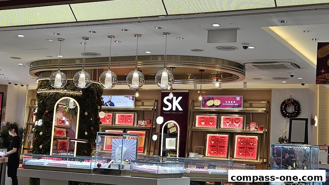 Interior view of SK Jewellery store with displays of gold jewelry and festive decorations.