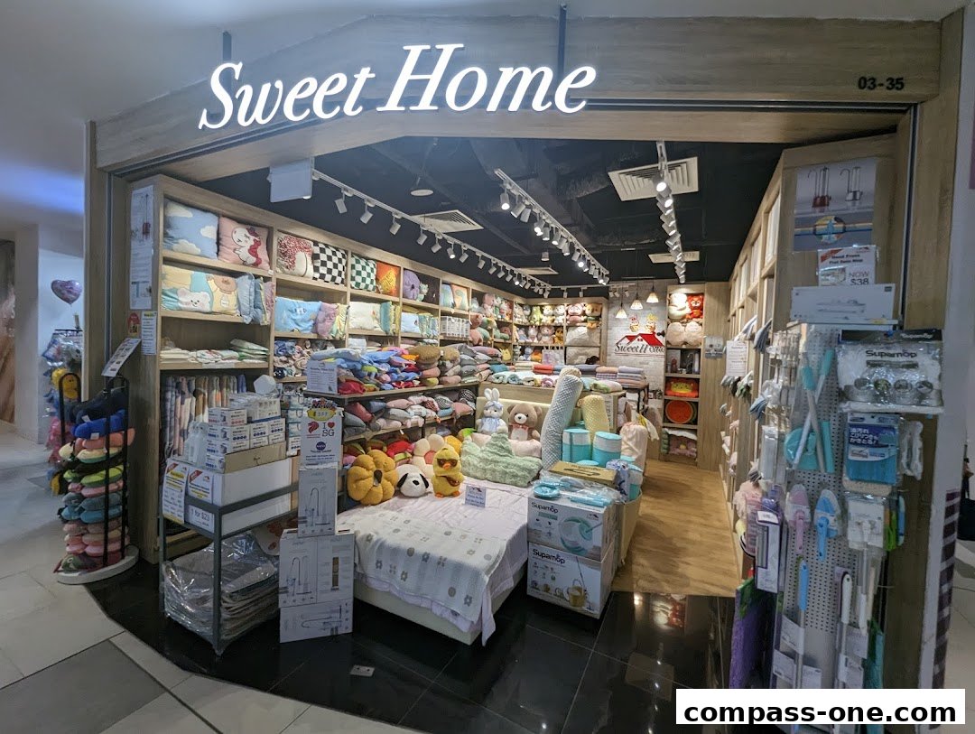 The "Sweet Home" shop displays a wide variety of home goods, including pillows, bedding, and cleaning supplies.