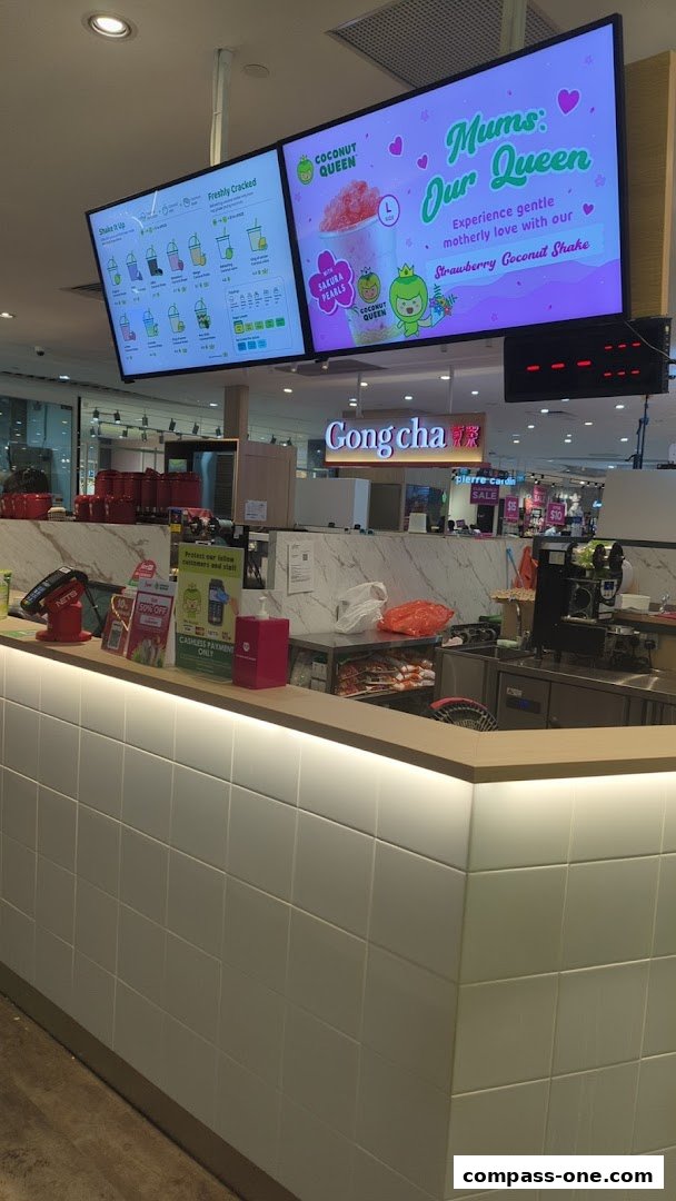 A counter display for Coconut Queen with a menu and a special offer for Mother's Day.