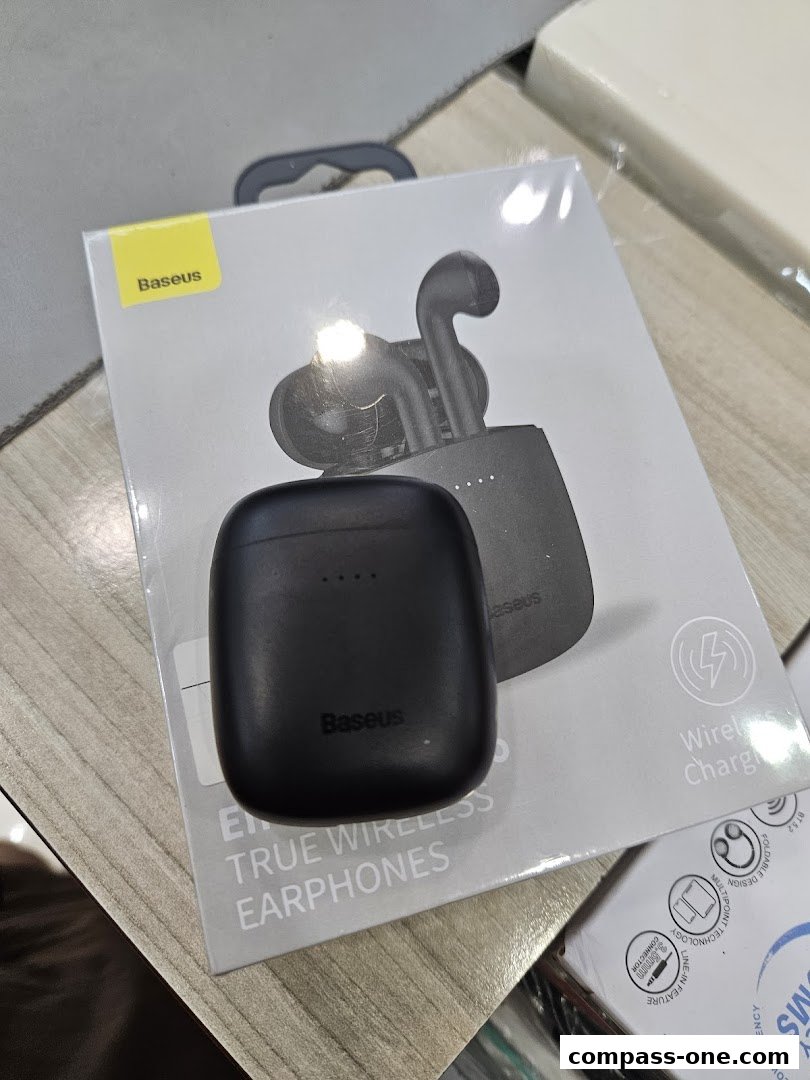 A box of black Baseus true wireless earphones with a charging case.