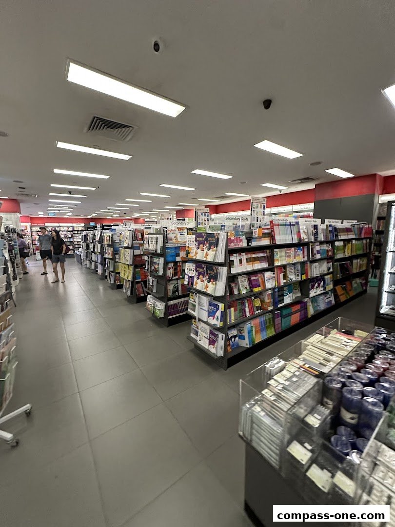 Interior view of a POPULAR Bookstore with shelves stocked with books and stationery items.
