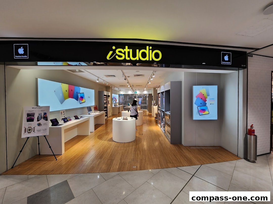 The entrance of an iStudio Apple Premium Reseller shop showcasing iPads and Apple Watch.