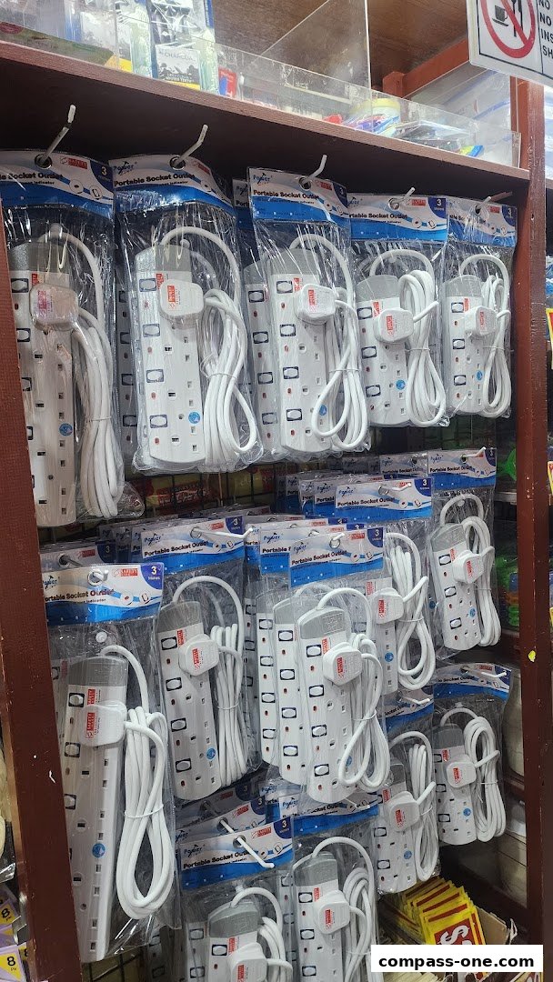 Shelves stocked with multiple portable socket outlets in clear packaging.