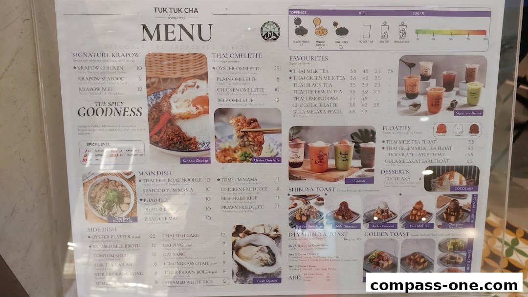 A menu from Tuk Tuk Cha Treasures featuring Thai dishes and drinks, with images of food and beverages.