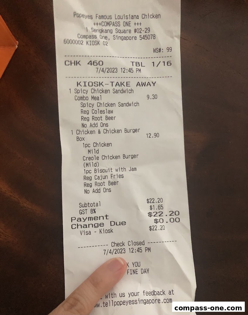 A receipt from Popeyes Famous Louisiana Chicken showing a Kiosk Take Away order.