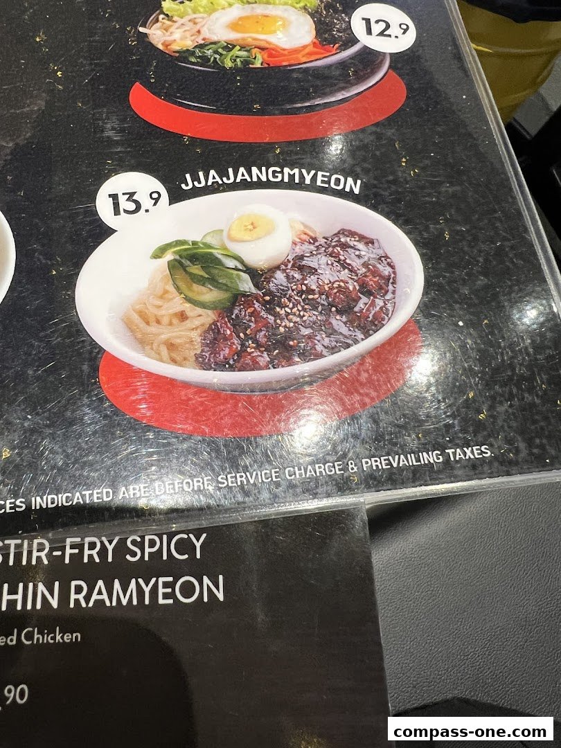 A menu featuring Korean street food dishes like Jjajangmyeon and Stir-fry Spicy Chin Ramyon.