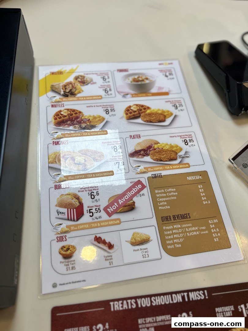 A KFC menu displaying breakfast items, burgers, sides, coffee, and other beverages.