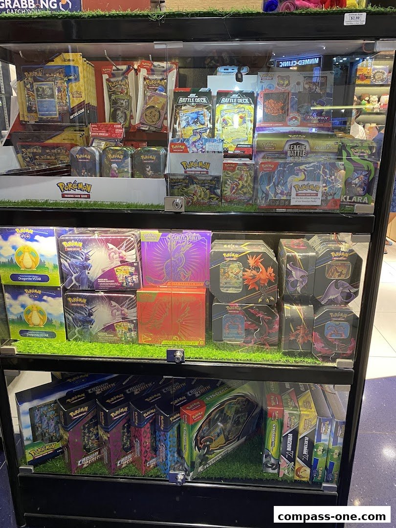 Display case filled with various Pokemon trading card game products and accessories.