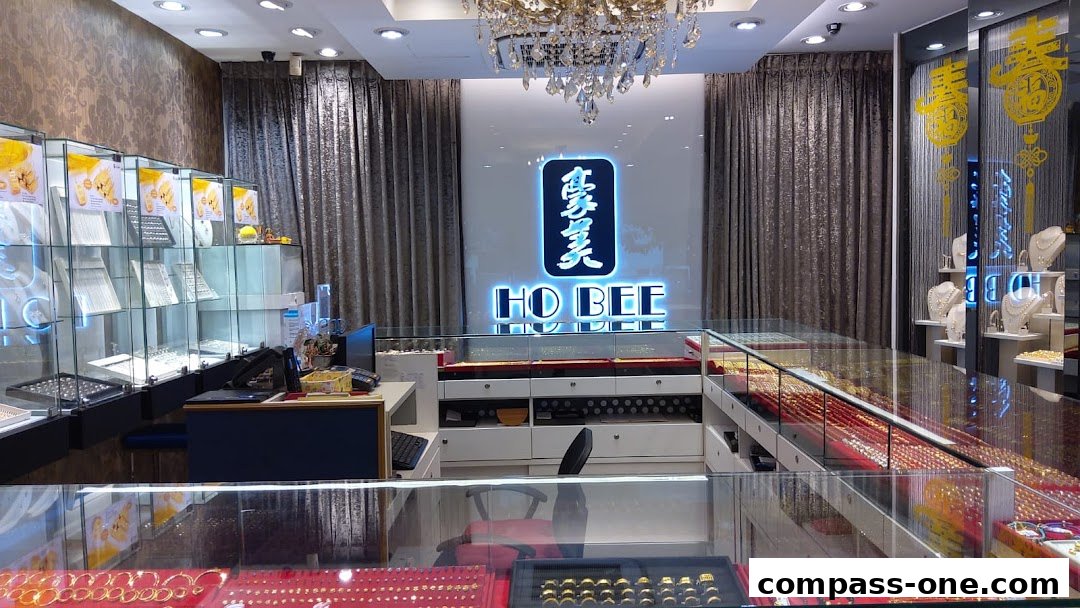 Interior view of Ho Bee Goldsmith showcasing a wide selection of jewelry in display cases.