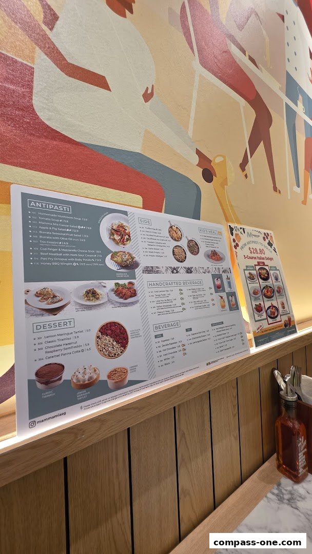A menu from Mamma Mia Trattoria E Caffè featuring antipasti, sides, desserts, and beverages.