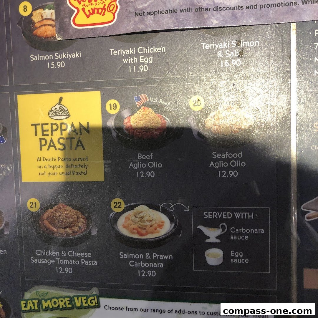 A menu display featuring various pasta dishes and their prices.