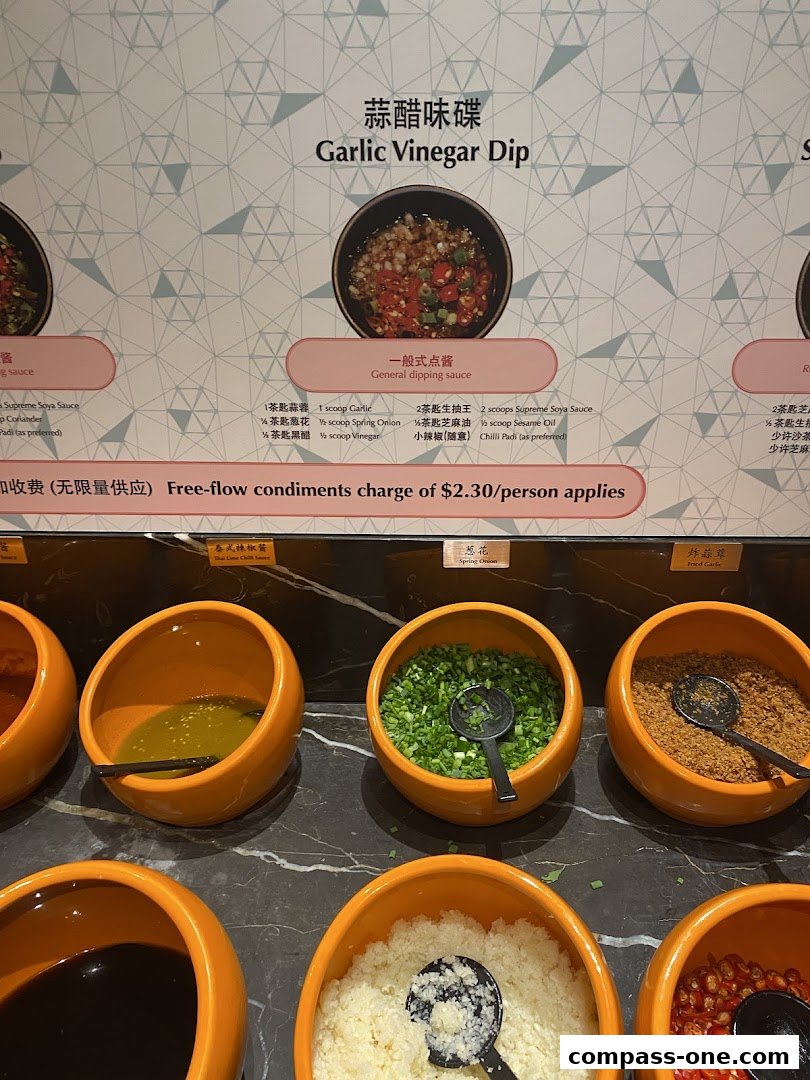 A display of various dipping sauce ingredients and a sign for a garlic vinegar dip.