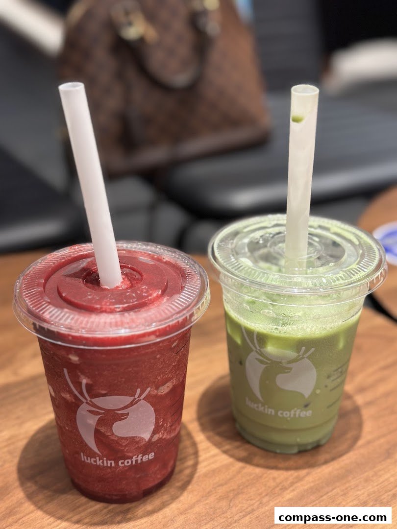Two refreshing drinks, one red smoothie and one green matcha latte, from Luckin Coffee.