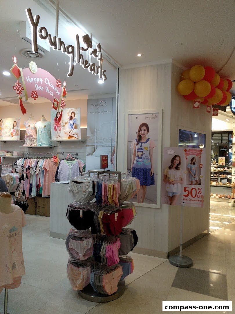 The entrance of a Young Hearts lingerie store with displays of underwear and apparel.