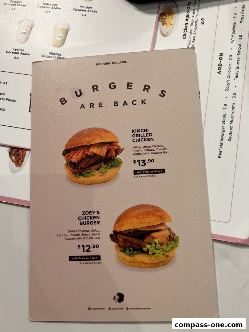 A menu from Zoeys featuring burgers, including Kimchi Grilled Chicken and Zoey's Chicken Burger.