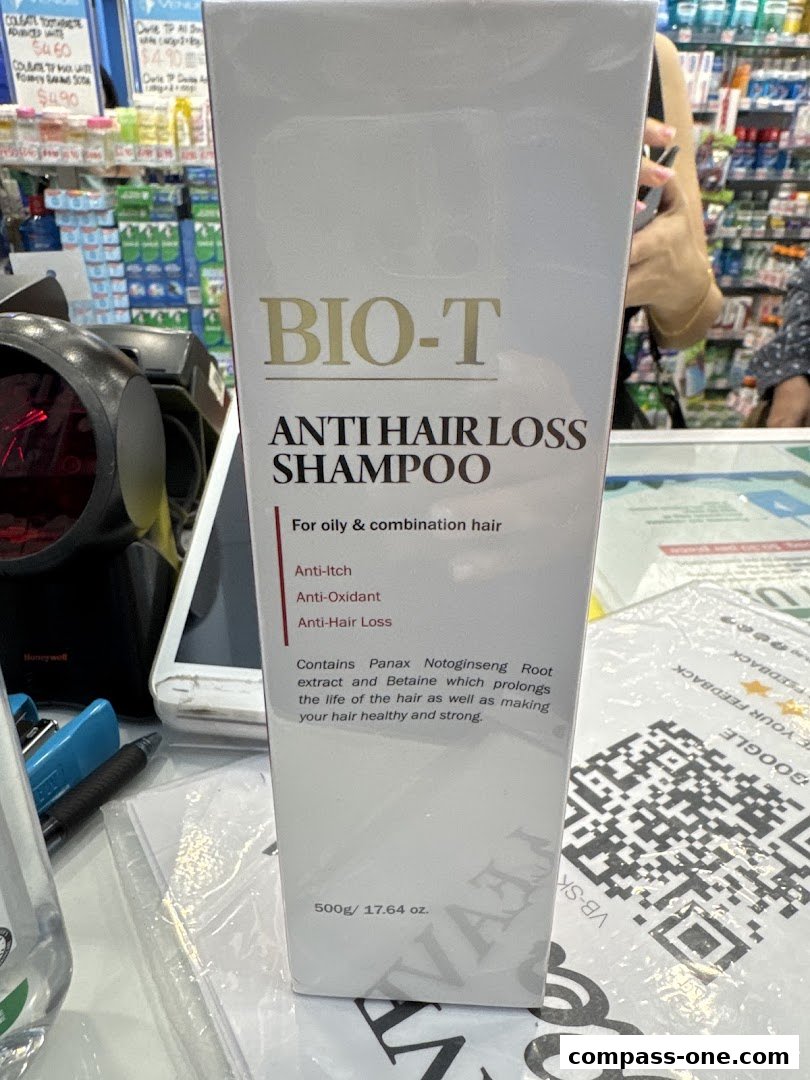 A box of BIO-T Anti Hair Loss Shampoo is displayed in a retail store.