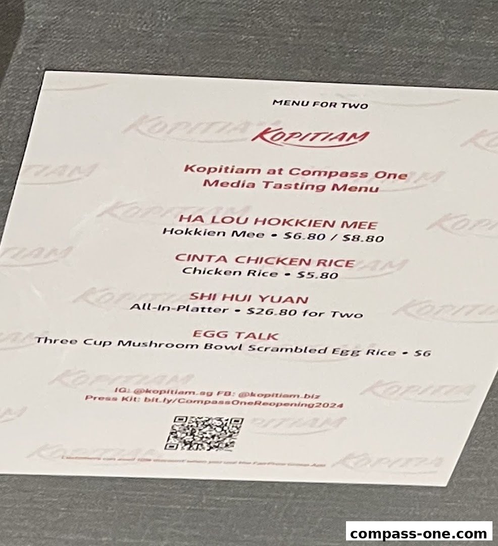 A menu from Kopitiam featuring dishes like Hokkien Mee, Chicken Rice, and All-in-Platter.