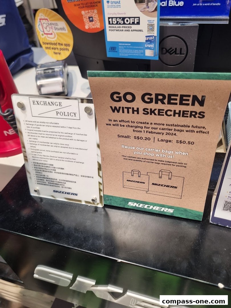A sign about Skechers' new policy on charging for carrier bags and an exchange policy sign.