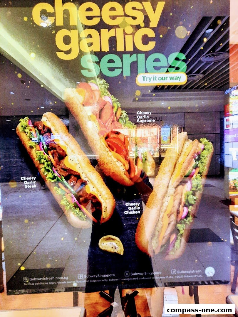 A promotional poster for Subway's Cheesy Garlic Series featuring three different subs.