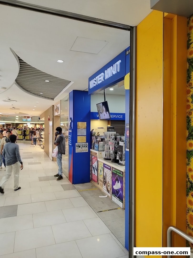 The entrance to Mister Minit, a shop offering various services and products.