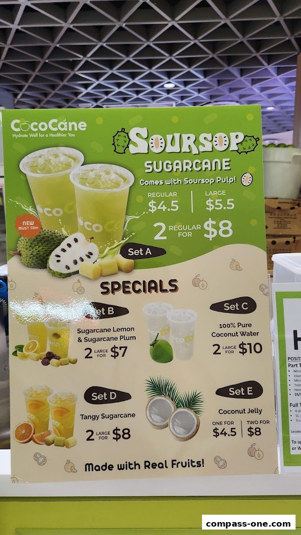 A menu board for CocoCane featuring Soursop Sugarcane drinks and other fruit-based beverages.