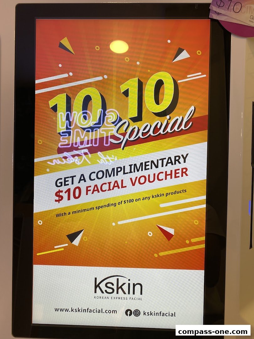 A digital display advertises a $10 facial voucher from Kskin Korean Express Facial.